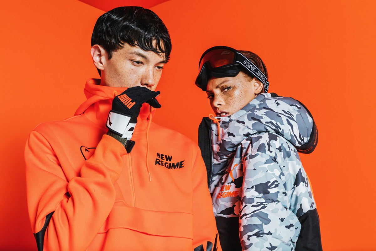 Deux silhouettes de la collection Atelier New Regime × PUMA sur fond orange